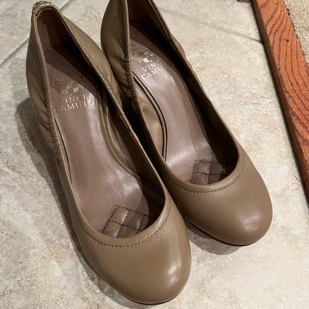 Short heels.  Super comfy.  Darker tan color heel.